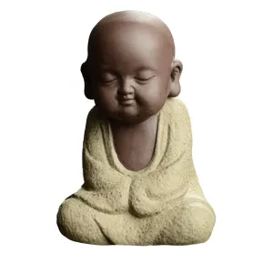 Buddha Statuette and the Monk in White